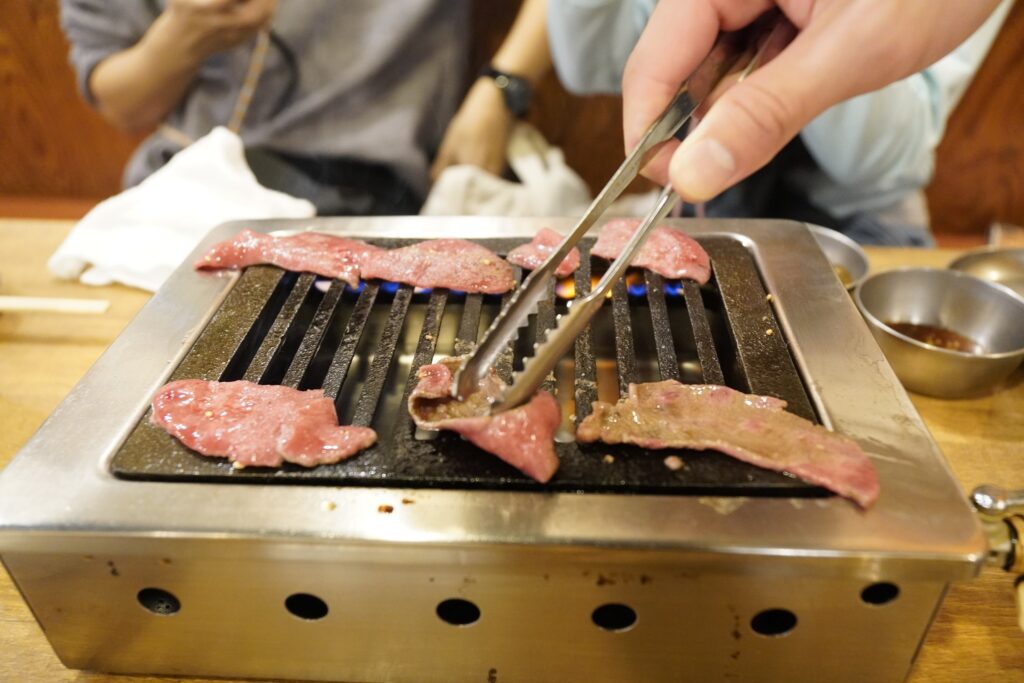 Staff providing grilling services for customers 